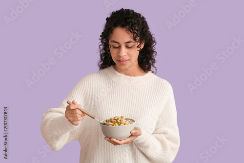 Young woman eating tasty ce...