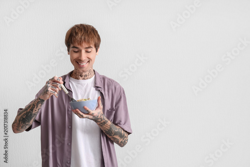 Man holding bowl with cerea...