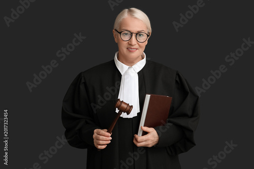 Mature female judge with bo...