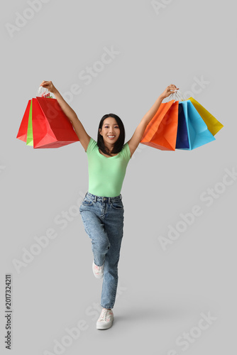 Young Asian woman with shop...