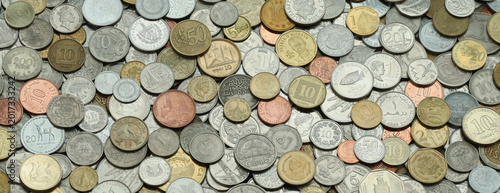 фотографія Scattered coins of multiple origins in big mound, detailed shot