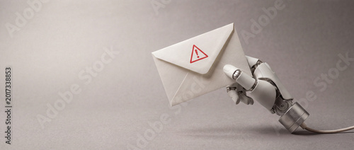 Bild auf Leinwand AI-driven phishing concept with robotic hand and warning envelope emerging from