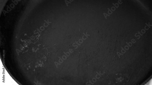 Place the frying pan on a hot electric stove.