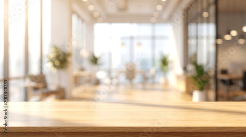 Wooden table top mockup with blurred warm office interior background and golden hour light for product display