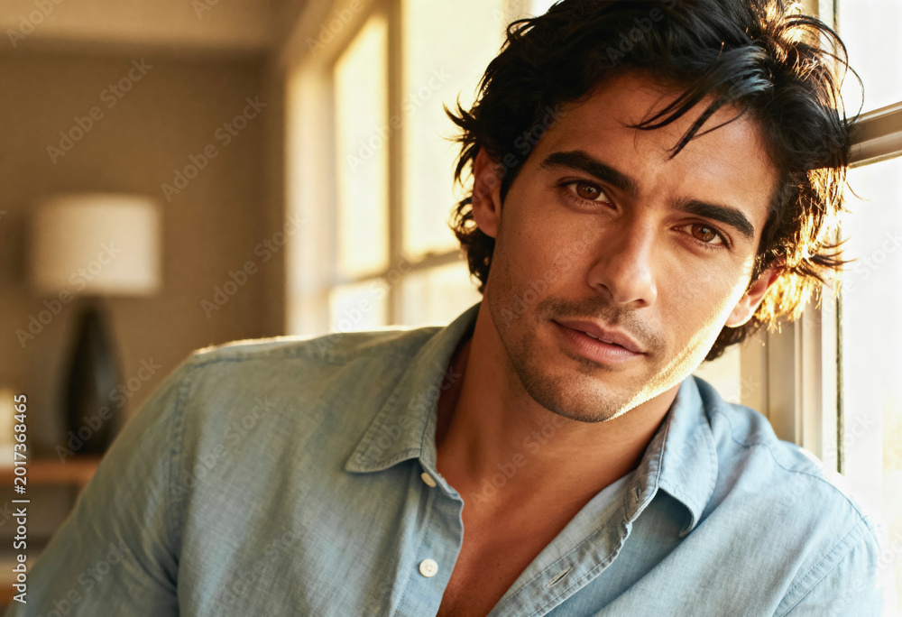 Fototapeta premium Charismatic latino man in early 30s with tousled black hair – modern lifestyle portrait for personal branding