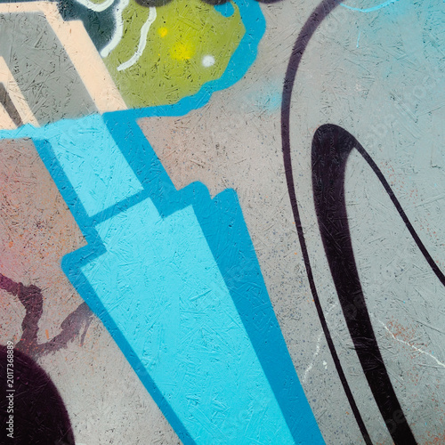 Close-up of abstract graffiti paint on textured OSB wooden panel