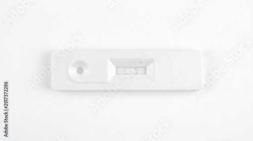 Rapid medical test cassette showing negative result on white background top view studio lighting
