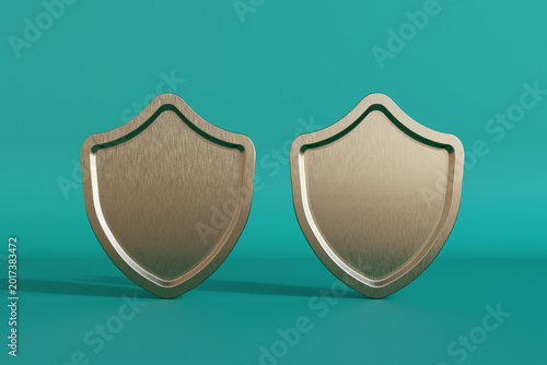 Two metallic shield icons standing side by side on a clean teal background re...