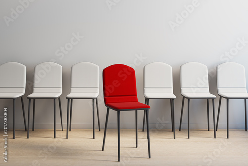 Single red chair standing out among uniform white chairs in a modern empty interior room symbolizing choice and uniqueness. 3D Rendering