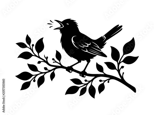 Canvas Print Black bird silhouette perched on a branch with leaves