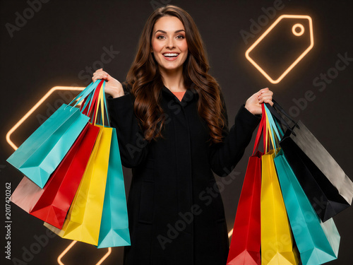 Happy woman holding shopping bags during Black Friday sale