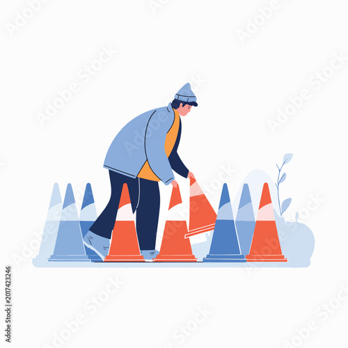 Man moving traffic cones outdoors.