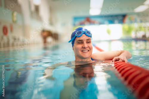 Visually impaired woman swimming in the swimming pool
