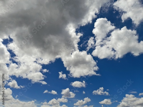 Dramatic Cumulus Clouds in a Bright Blue Sky with Natural Sunlight