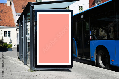 blank poster sign panel bus shelter. billboard mockup display. white lightbox sign in bus stop. digital panel. city transit station. urban street. park setting. outdoor advertising