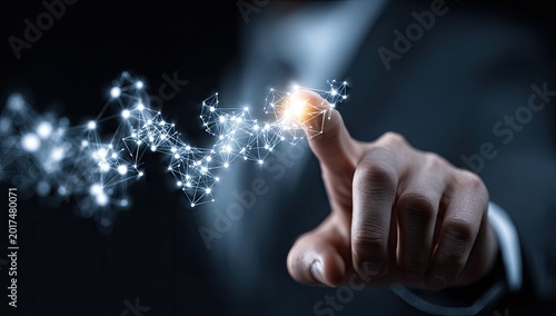 Futuristic Technology Concept - Finger Touching Glowing Network of Lights.