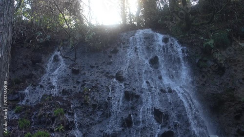 Waterfall in the Deep Forest with Sunlight Streaming from Above, Yamagata, Japan, 2026