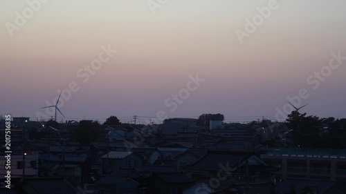 Silhouette of Windmills in a Residential Area During Dusk, Japan, 2026