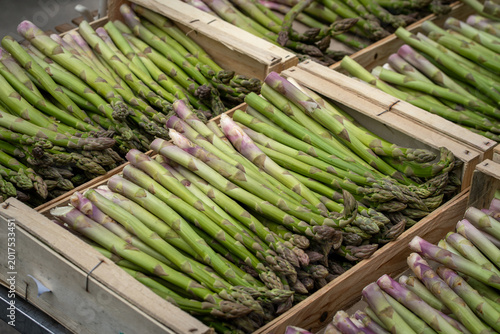 fresh green asparagus at market stall