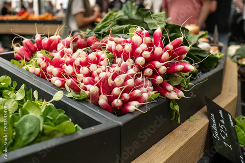 fresh radishes at farmers market stall