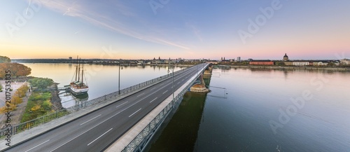 Empty Theodor Heuss Bridge over Rhine River at sunrise