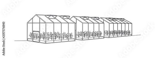 Modern greenhouse expansion with rows of young plants growing inside