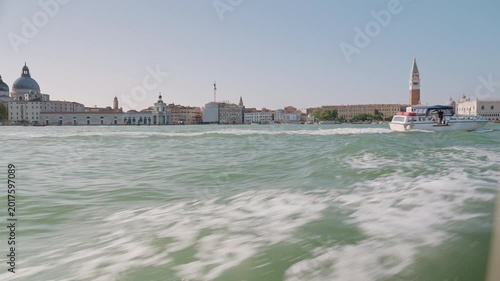 Moving vaporetto crossing the Venice lagoon between islands. Piazza San Marco, historic city center