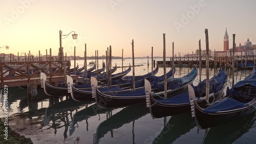 Gondolas Moored in Venice Lagoon with San Giorgio Maggiore in Background. Italy travel, tourism, romantic destinations and historic European atmosphere.