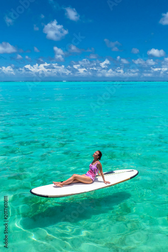  Paradise beaches of the Maldives. Tourism, travel and vacation in a luxury resort. Woman in bikini on the background of the sea and the beach