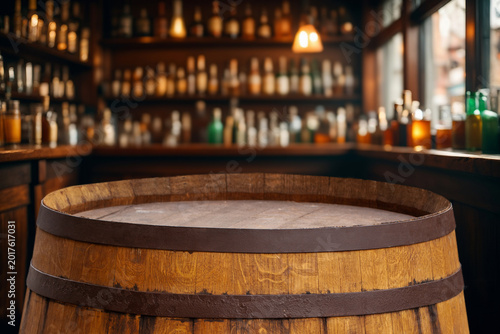 Foto Wooden barrel in the foreground as a table and a blurred background of a bar or