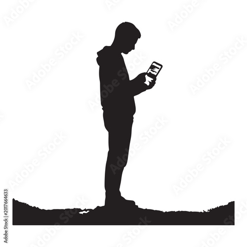 Silhouette of a young person in a hooded jacket looking at a smartphone male de