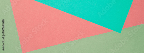 Abstract colorful geometric paper collage with pastel triangles and layered t...