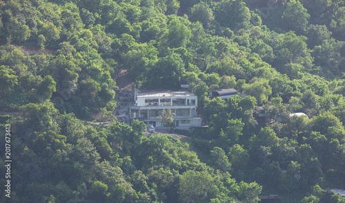 Фотография view of a country house in a summer forest