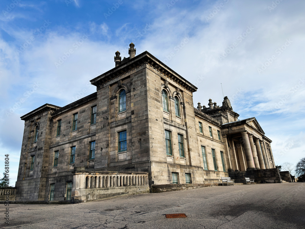 Fototapeta premium Grand neoclassical stone Modern Two Dean Gallery building with tall columns in Edinburgh, Scotland, UK under a dramatic cloudy sky