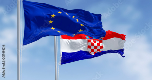 Schilderij op canvas Flags of Croatia and the European Union fluttering together on a clear day