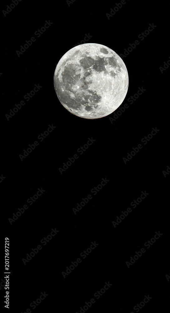 Obraz premium Large, bright full moon glowing brightly against a deep black, starry night sky. Perfect celestial backdrop for design projects, natural, celestial, overlay
