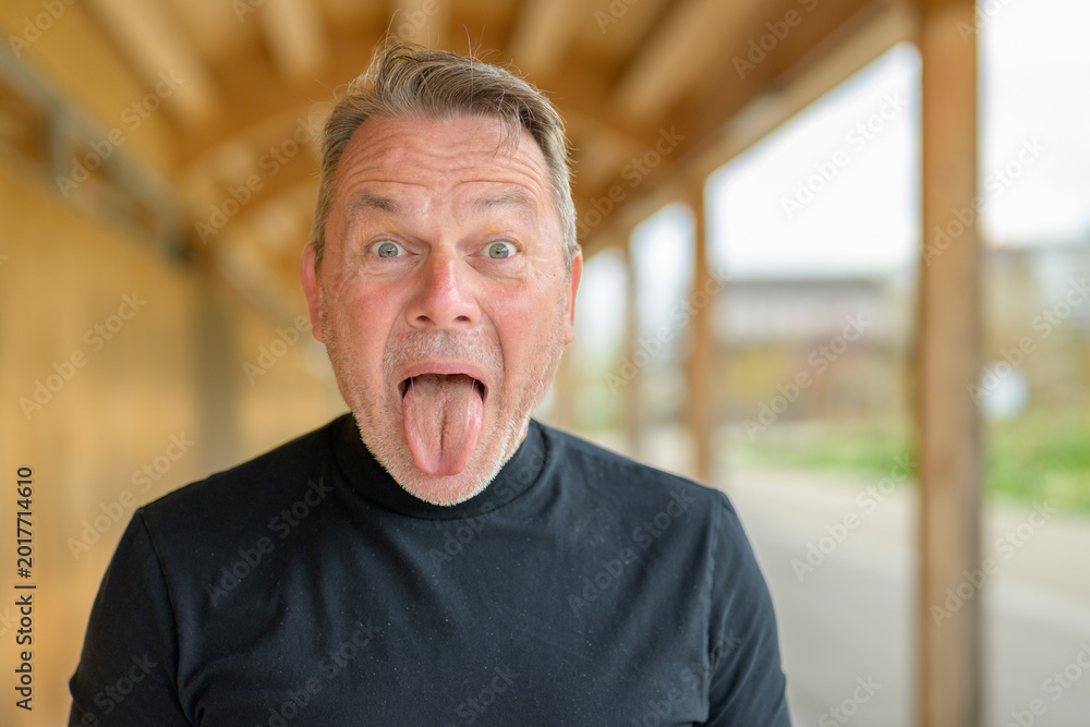 Fototapeta premium Funny mature man making faces