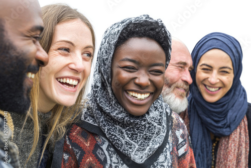 Smiling people of different nationalities close-up on white background.