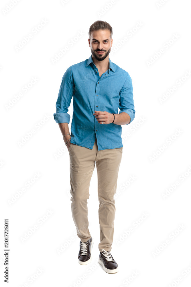 Fototapeta premium Confident smart casual man walking forward