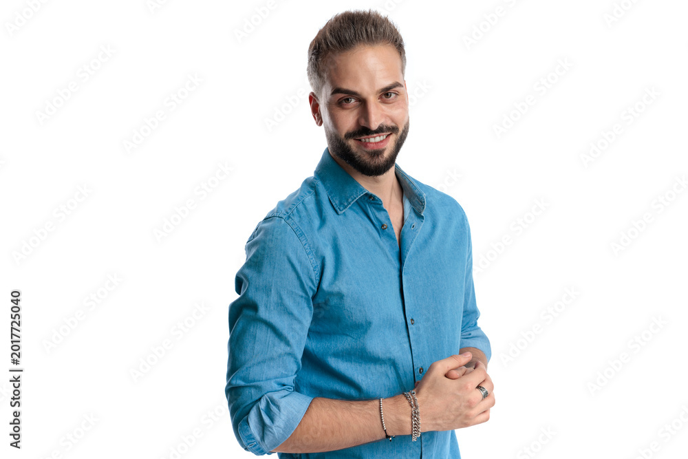 Obraz premium Confident casual man rubbing hands and smiling