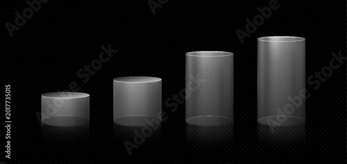 Schilderij op canvas A set of clear glass cylindrical podiums of varying heights on a black background