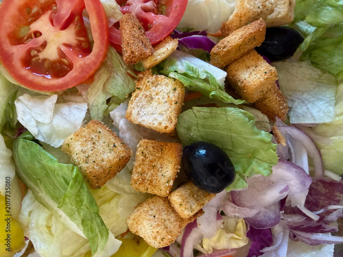Colorful, Fresh Garden Salad with Croutons, Tomatoes, Red Onion, and Black Olives