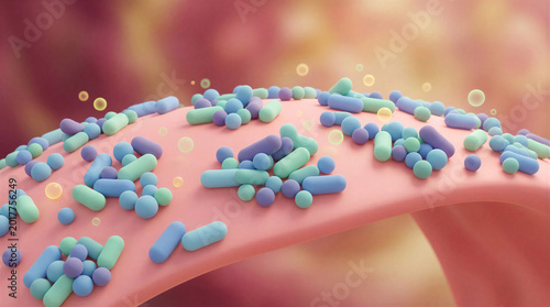 Microscopic view of colorful bacteria on a pink surface  