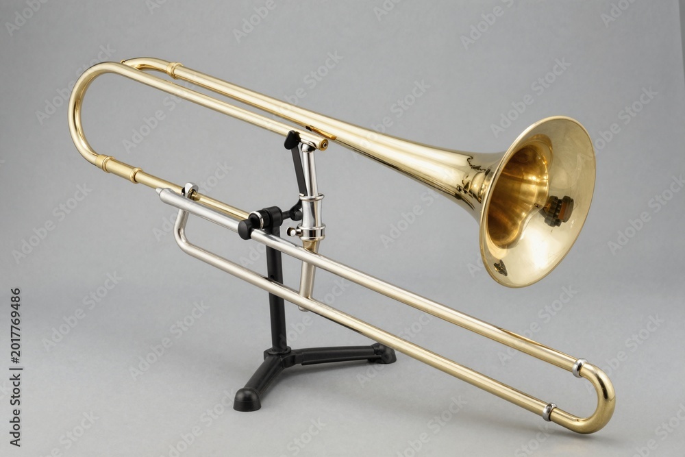 Obraz premium Elegant Brass Trombone on Music Stand