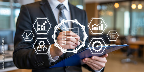Businessman checking financial data and quality control checklist on clipboard with virtual interface icons