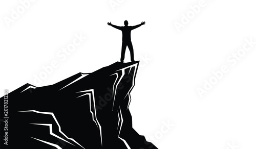 Bild auf Leinwand man standing with arms raised on a mountain peak black and white silhouette high