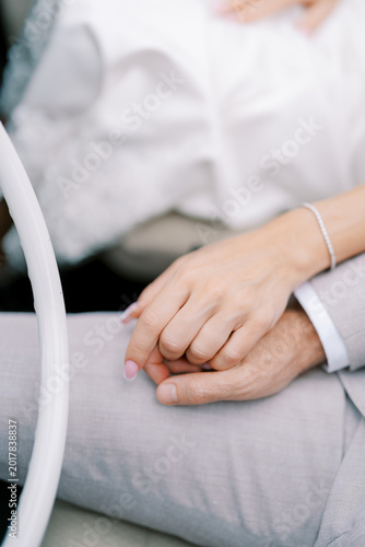 Canvastavla Intimate scene showing two hands clasped softly with wedding rings present
