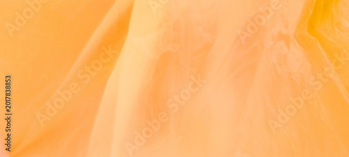 Soft coral translucent fabric texture with flowing folds, warm dreamy tones, diffused lighting, airy textile layers, and elegant abstract pastel background.