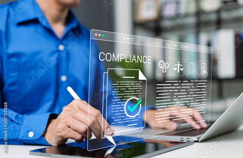 Compliance document approval and regulatory audit workflow concept. Businessman using laptop with verified, checkmark, legal icon, checklist, policy review, quality control, certificate, certification