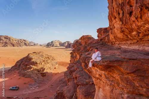 Photography Woman traveling in Wadi Rum desert landscape, Jordan